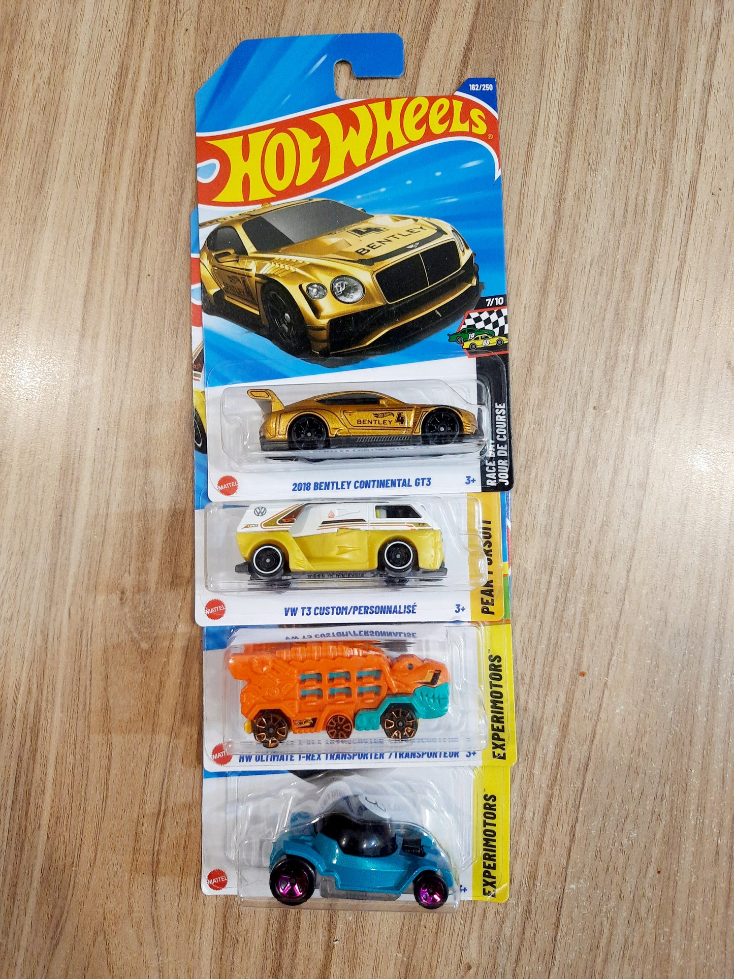 Hot Wheels 2018 Bengley Continental GT3, Vw T3 Custom, HW Ultimate T-Rex Transporter & Decidedly Go(combo pack of 4)