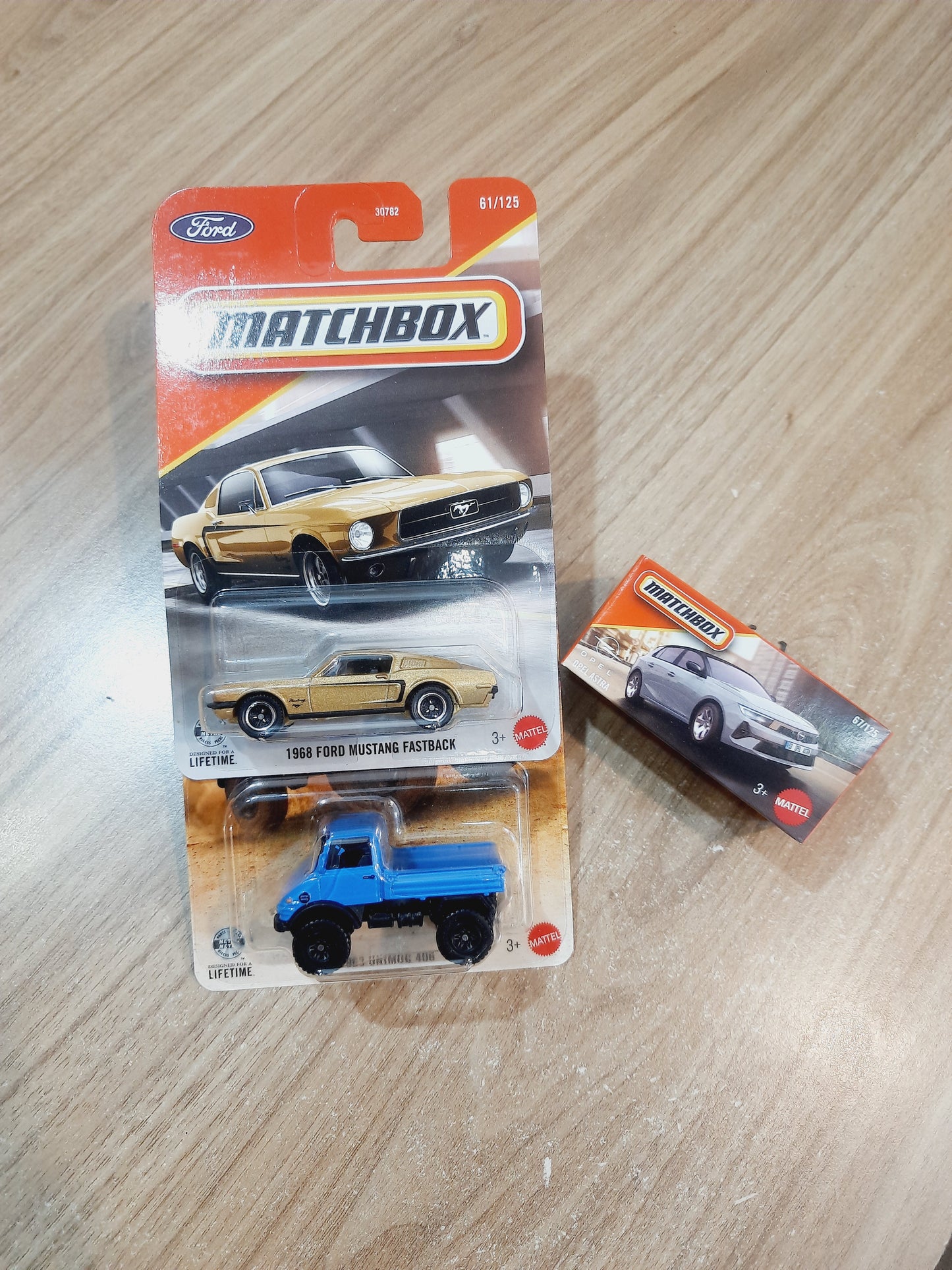 (Creased Cards) Matchbox 1968 Ford Mustang Fastback, 1963 Unimog 406 & Opel Astra