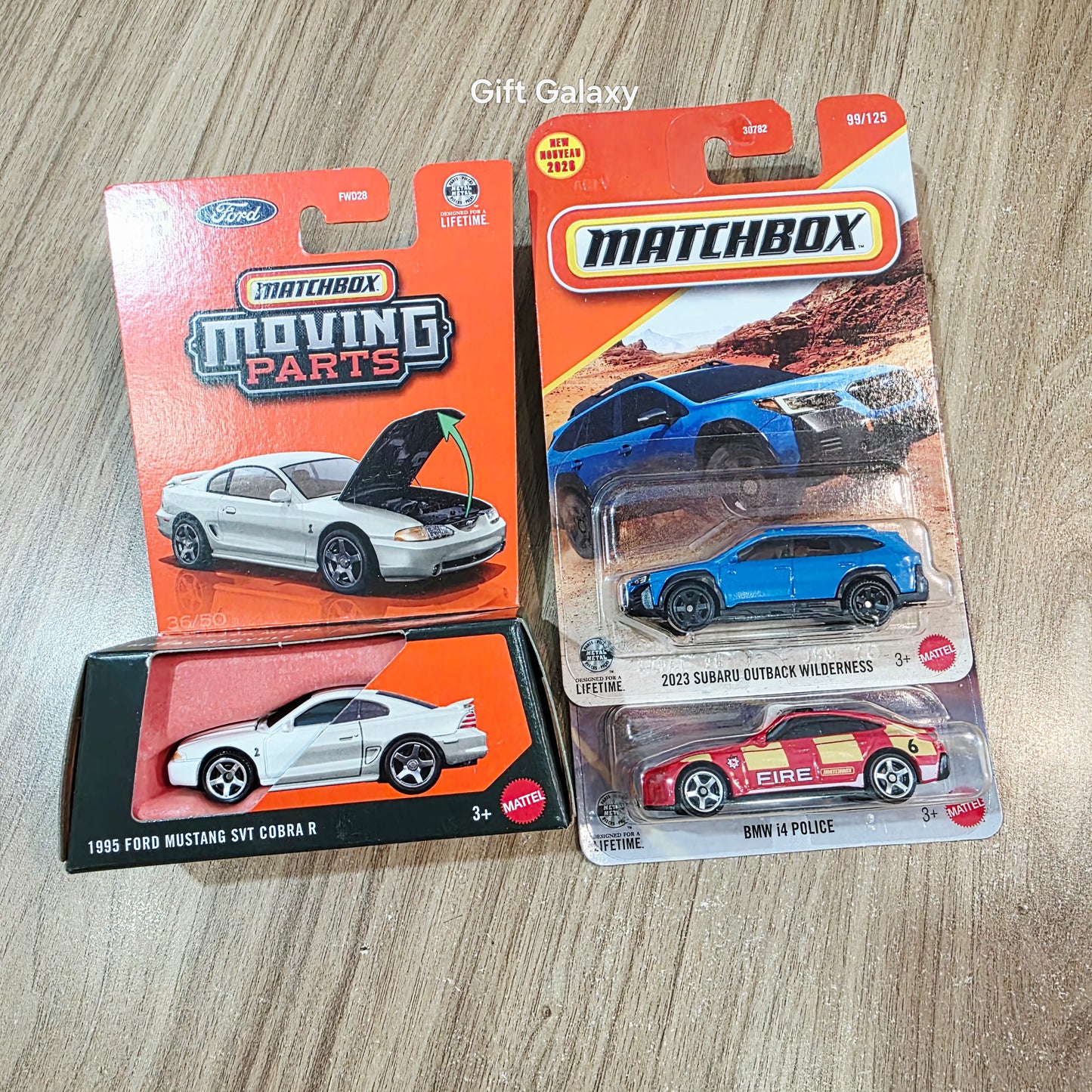 Matchbox Moving Parts 1995 Ford Mustang SVT Cobra R, 2023 Subaru Outback Wilderness & Bmw i4 Police