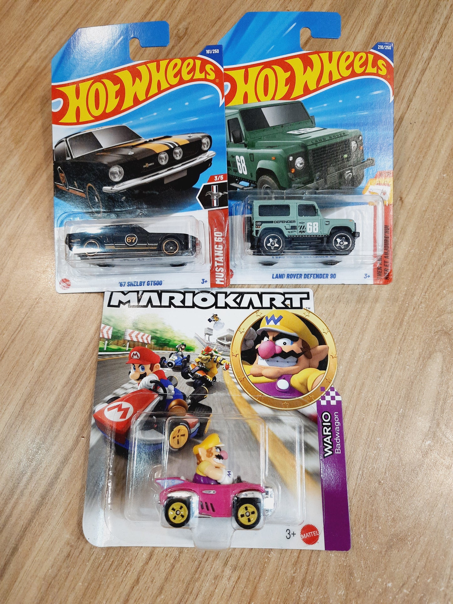 Hot Wheels Wario Badwagon (Creased Card), Land Rover Defender 90 & 67 Shelby GT500 (combo pack of 3)