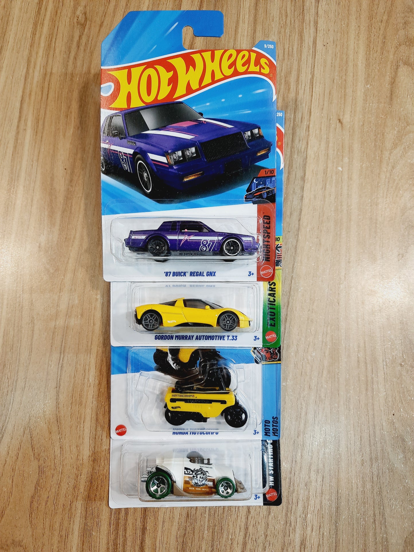 Hot Wheels Treasure Hunt 87 Buick Regal GNX, Gordon Murray Automotive T.33, Honda Motocompo & Instant Boost (pack of 4)