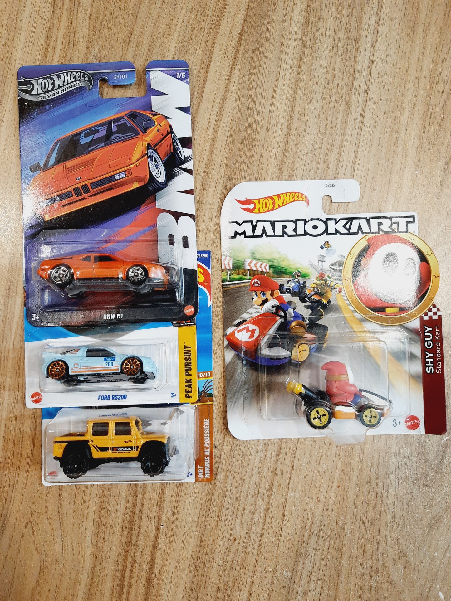 (Bent Card) Hot Wheels Shy Guy Standard Kart, BMW M1, Ford RS200 & 15 Land Rover Defender Double Cab (combo pack of 4)