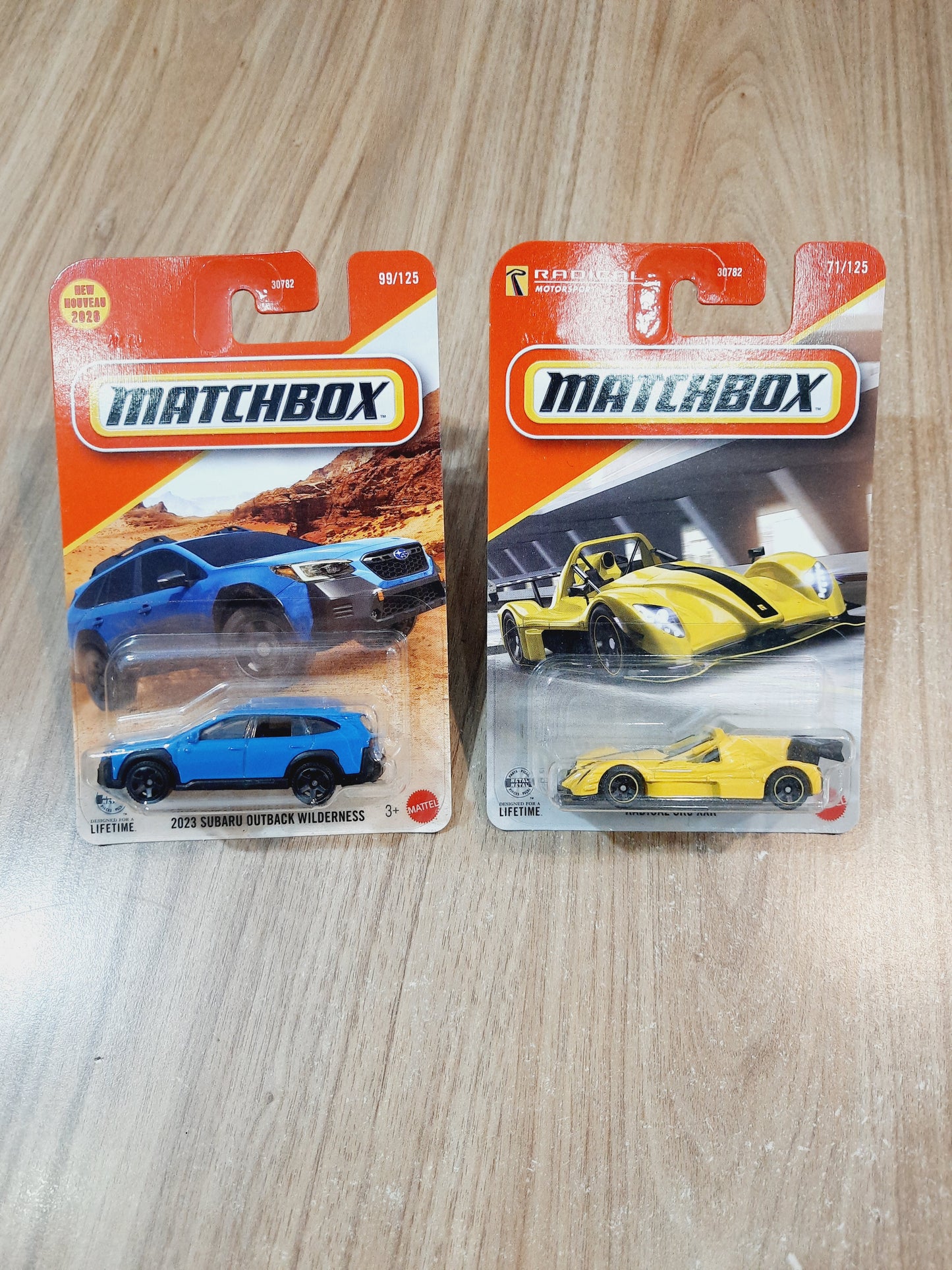 Matchbox 2023 Subaru Outback Wilderness & Radical SR3 XXR Diecast Scale Model